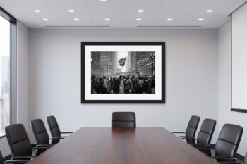 Black and white photograph of protesters marching through the streets of Chicago displayed in a corporate office