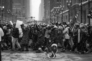 Photograph of people in chicago marching in the streets covered in snow