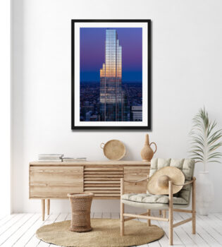 Large fine art photographic print of a skyscraper in Chicago at sunrise displayed in a bright home