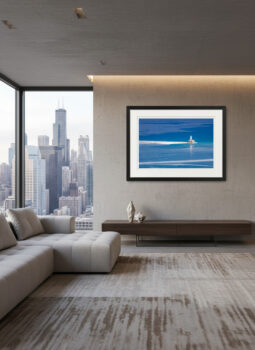 large fine art photograph of a lone lighthouse on a deep blue Lake Michigan during winter displayed in a modern condo.