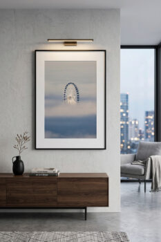 framed fine art image of a ferris wheel sticking out above the clouds