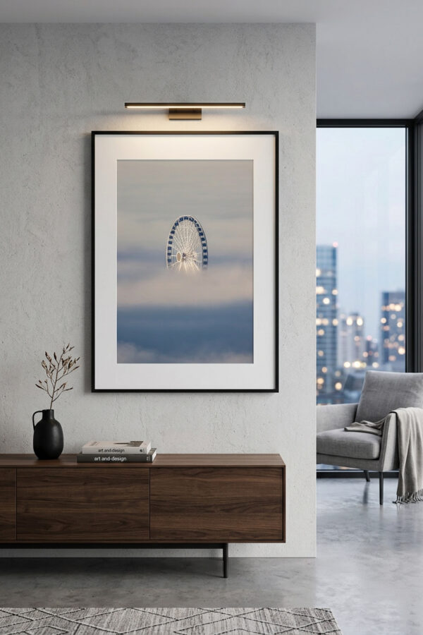framed fine art image of a ferris wheel sticking out above the clouds