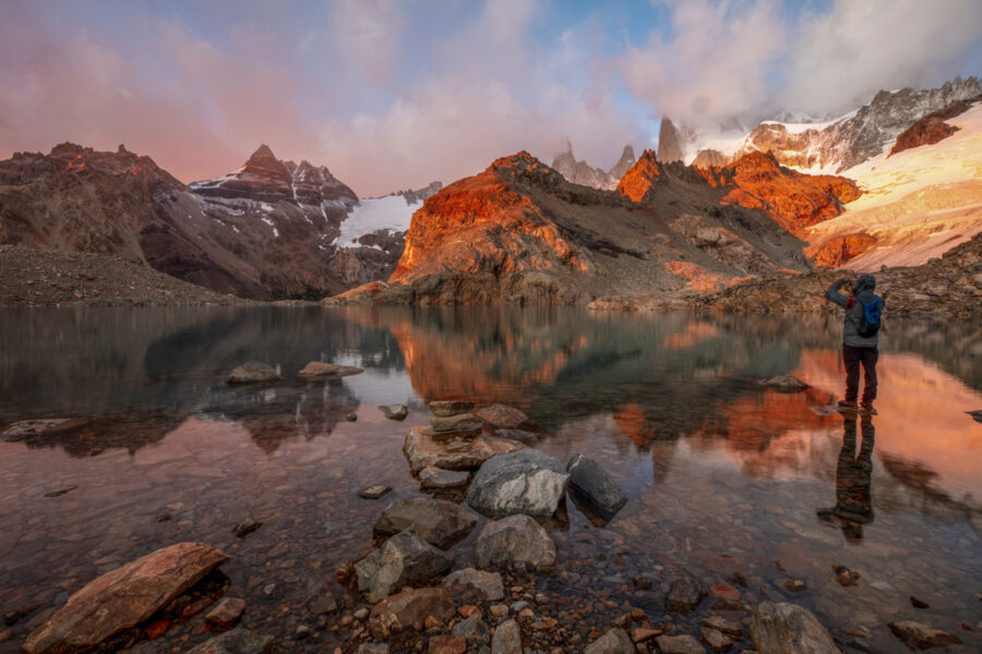 Man standing in an alpine lake in Patagonia